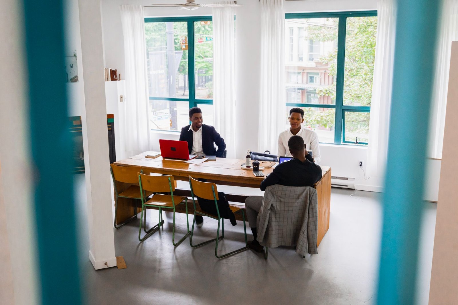 Business professionals in discussion around a meeting table